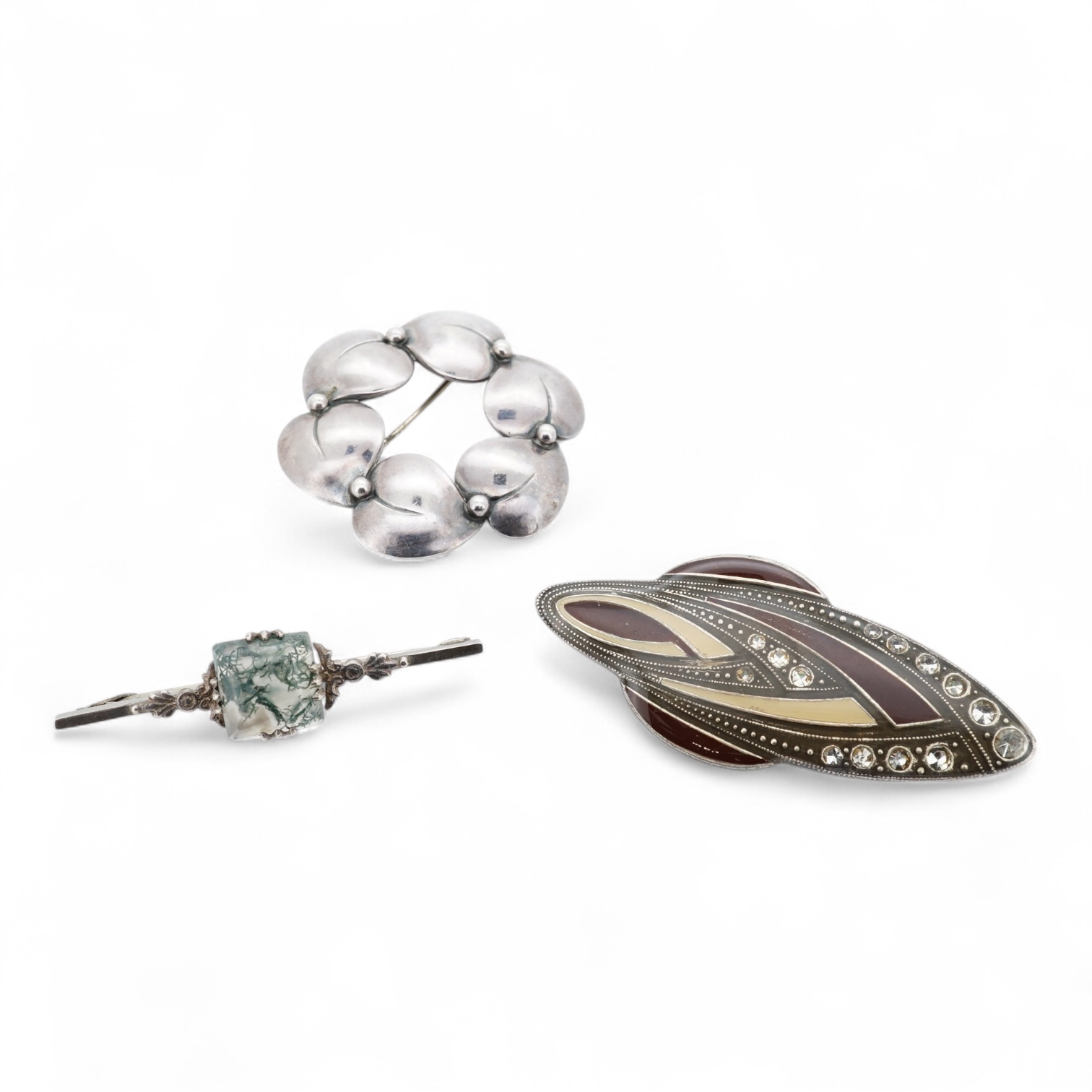 A 1960's Danish silver foliate brooch, by Nils Erik From, import marks possibly for Henry James Hulbert, London, 1964, 37mm, together with a moss agate set white metal bar brooch and a two colour enamel and paste set met